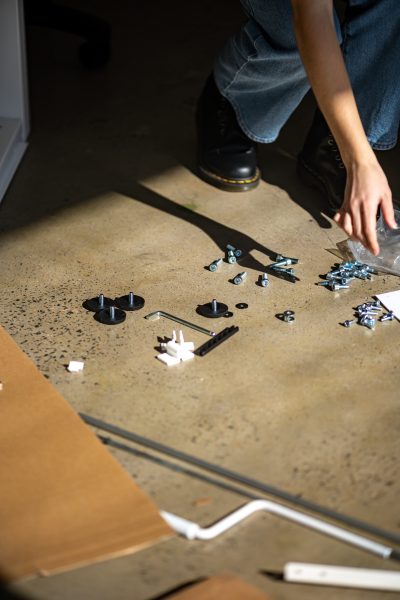 handyman sorting out screws for furniture assembly